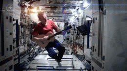 He is just playing guitar floating around...