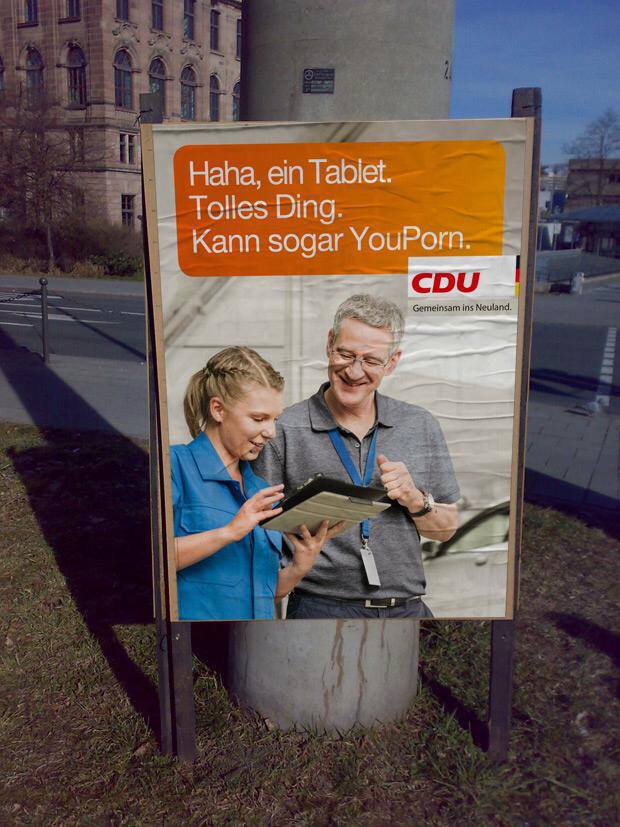 Electionposter-Streetart (Haha, a tablet. Great thing. Can even YouPorn.)