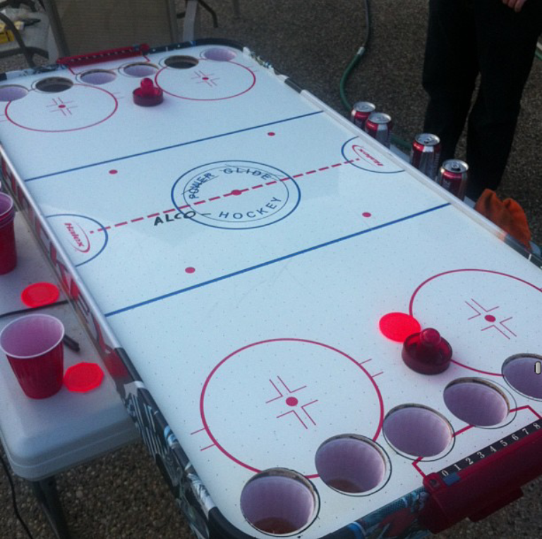 Alcohockey - the Canadian variation of beer pong.