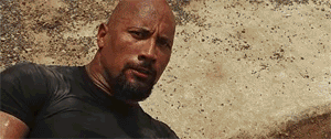 Vin Diesel picks a rock from the ground