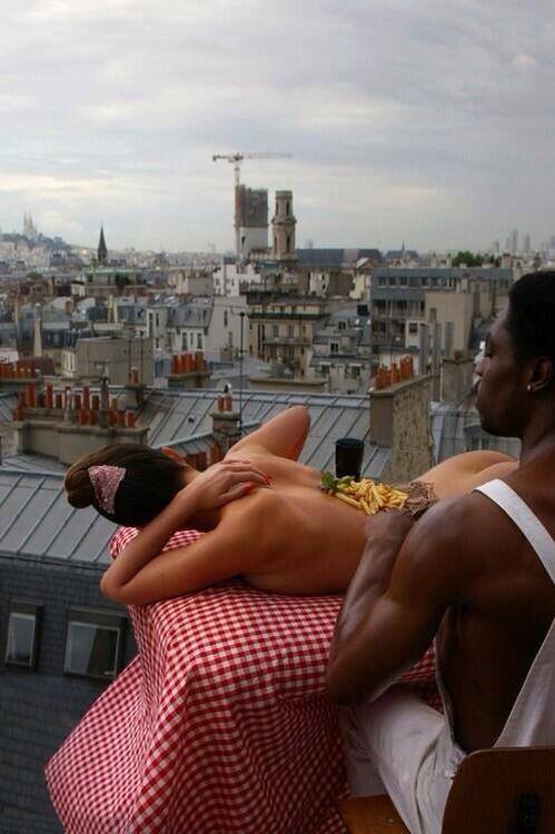 Eddie Murphy eating a skirt steak and fries off the back of a naked model somewhere in Europe