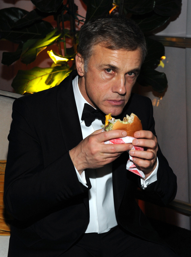 Christopher Waltz eating a burger