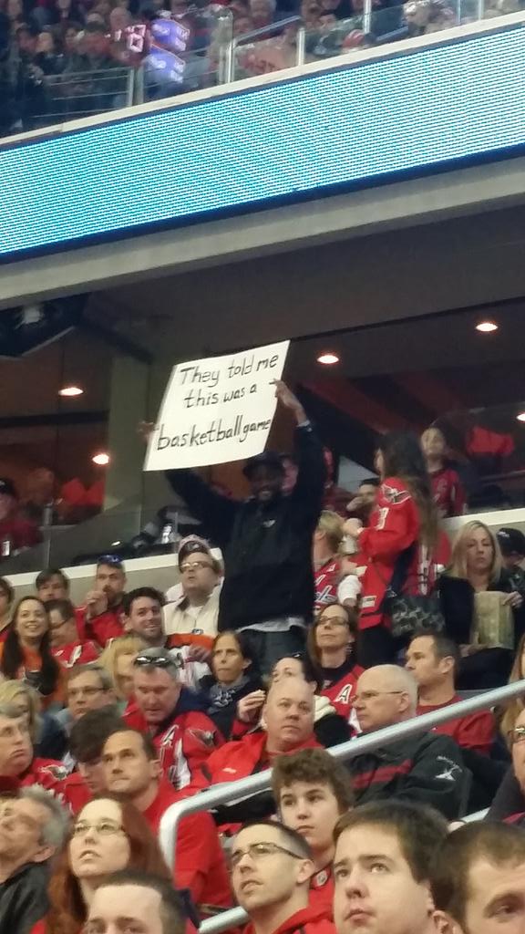 Black dudeâ€™s sign at a hockey game