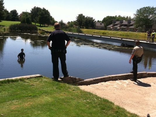 Criminal jumps in pond and the waiting game ensues.