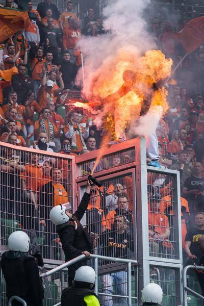 This happened when security guard used pepper spray on soccer fan that was was holding flare.