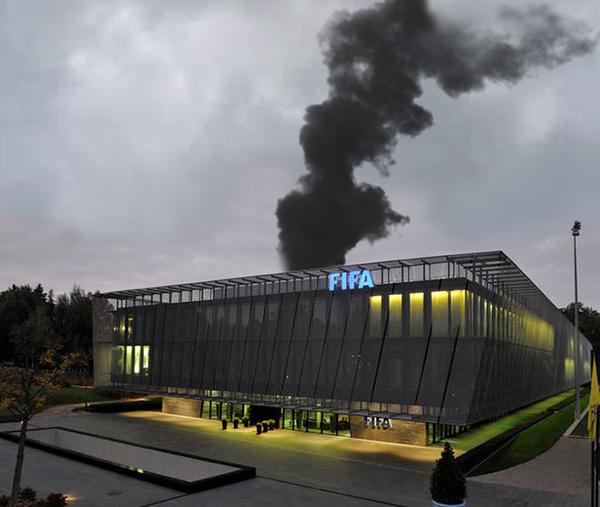 Black smoke rises from the back of FIFA HQ indicating the ceremonial burning of the documents.