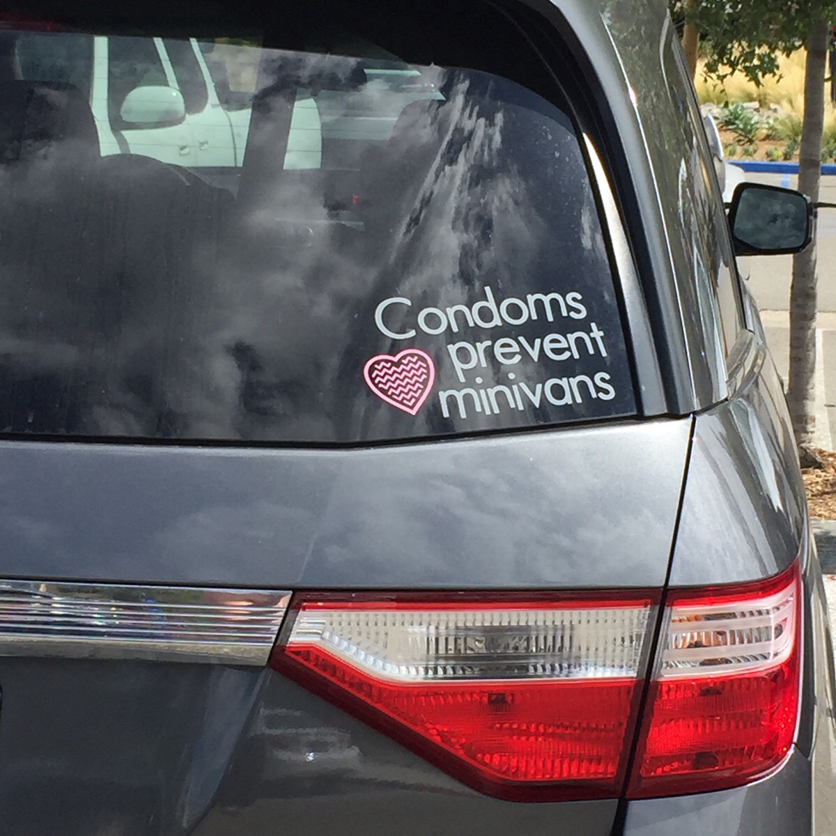 This sticker on a minivan. Even more perfect.