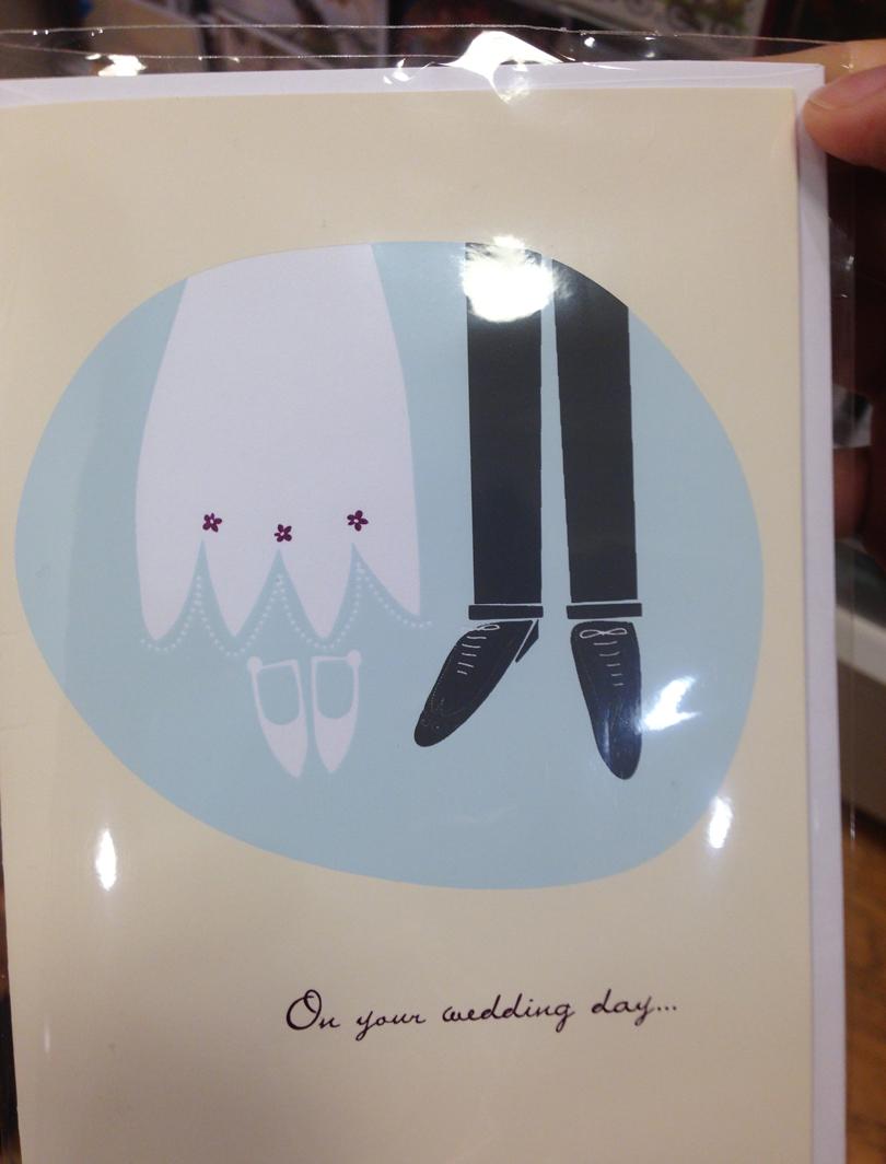 This wedding card looks like the Bride & Groom hung themselves.