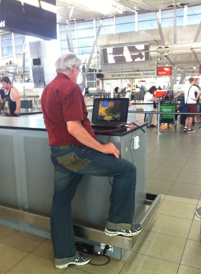 This guy at the Airport playing Age of Empires on his knee.