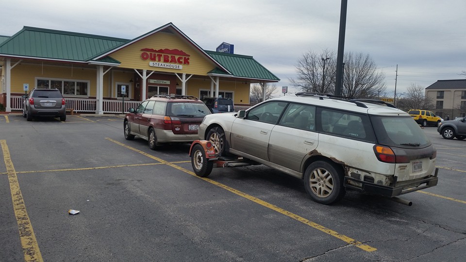 An Outback pulling an Outback, stopped to eat at Outback, parked outback.