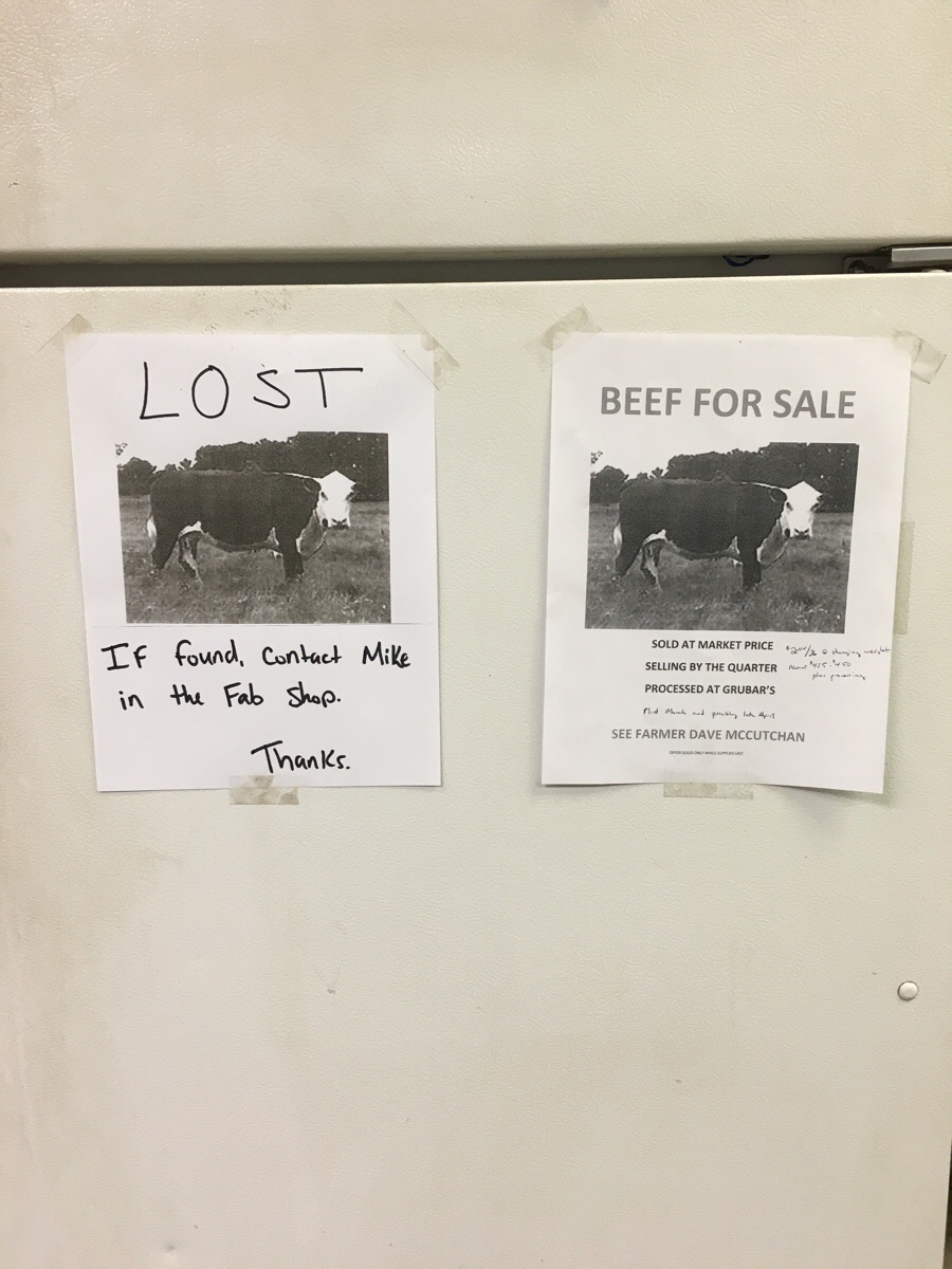 A farmer at work is selling beef from his cows. His sign is on the right. Mine is on the left..