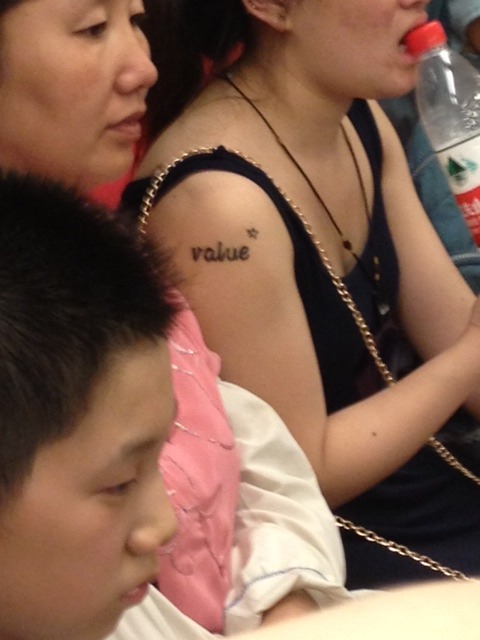 Finally, an Asian with a random English word tattoo on them