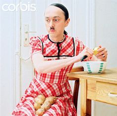 Successfully faking his death, Hitler begins his new life as a common housewife.