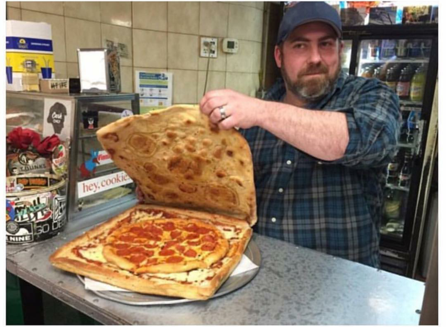 Pepperoni pizza inside pizza box made up of cheese pizza