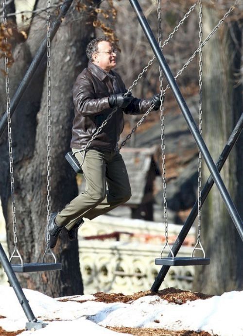 I know we've all been a little down lately, so here is a picture of Tom Hanks on a swing.