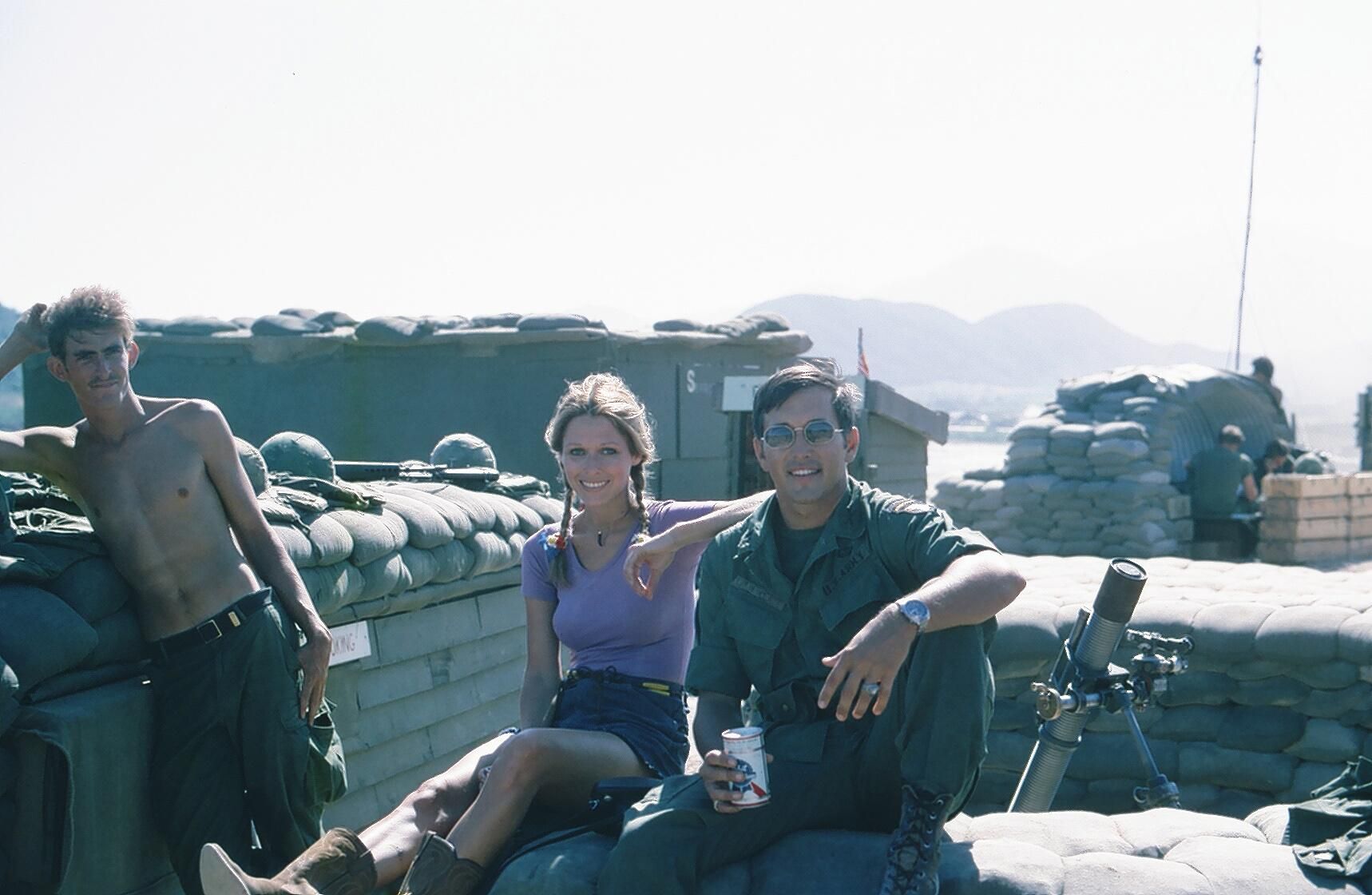 My dad drinking PBR with a Playboy Bunny in Vietnam, 1969.