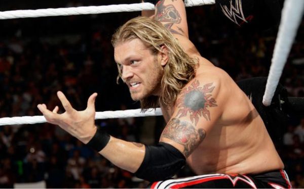 Edge living on the edge doing the spear (which sadly has no edges, but the wrestling ring does!)