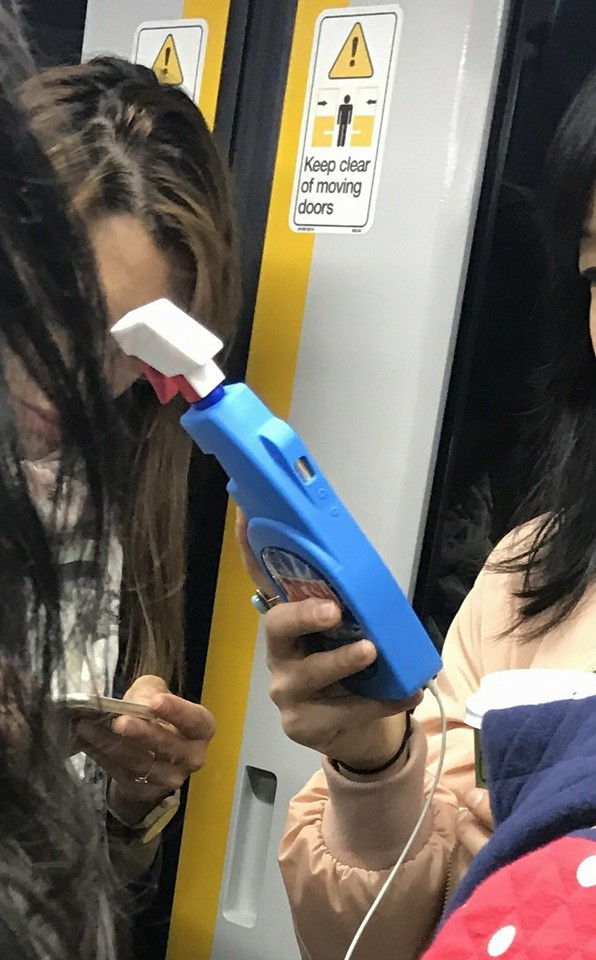 A phone case replica of a cleaning product spray bottle.