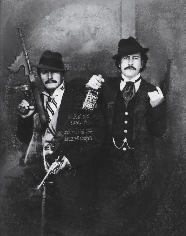 Pablo Escobar posing as a gangster with his cousin Gustavo in the 1980s.
