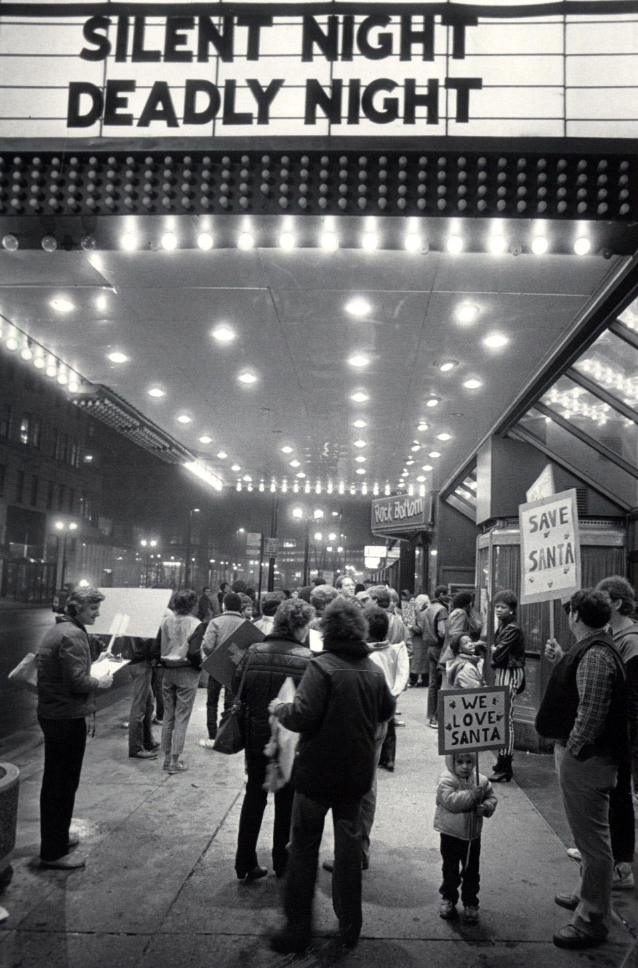 Protestors outside of a theater for the 1984 Santa-slasher, "Silent Night Deadly Night"