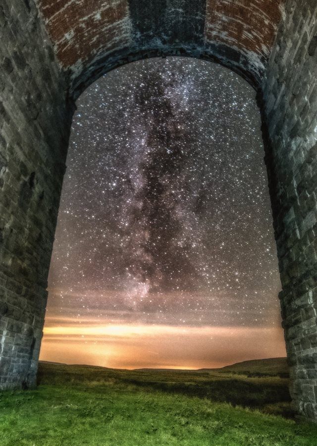 Took this picture last night of the milky way through a viaduct arch in England.