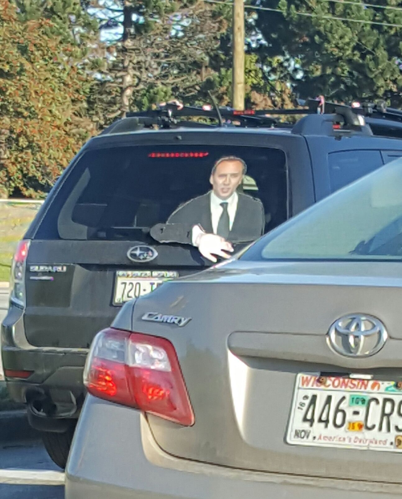 Saw this on my way to work today- they have a cardboard cutout of Nic Cage in the back window, with his arm attached to the rear wiper, so he can wave to everyone.