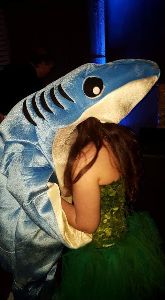 This guy was dressed as Katy Perry's shark in a party an this is him kissing a girl.