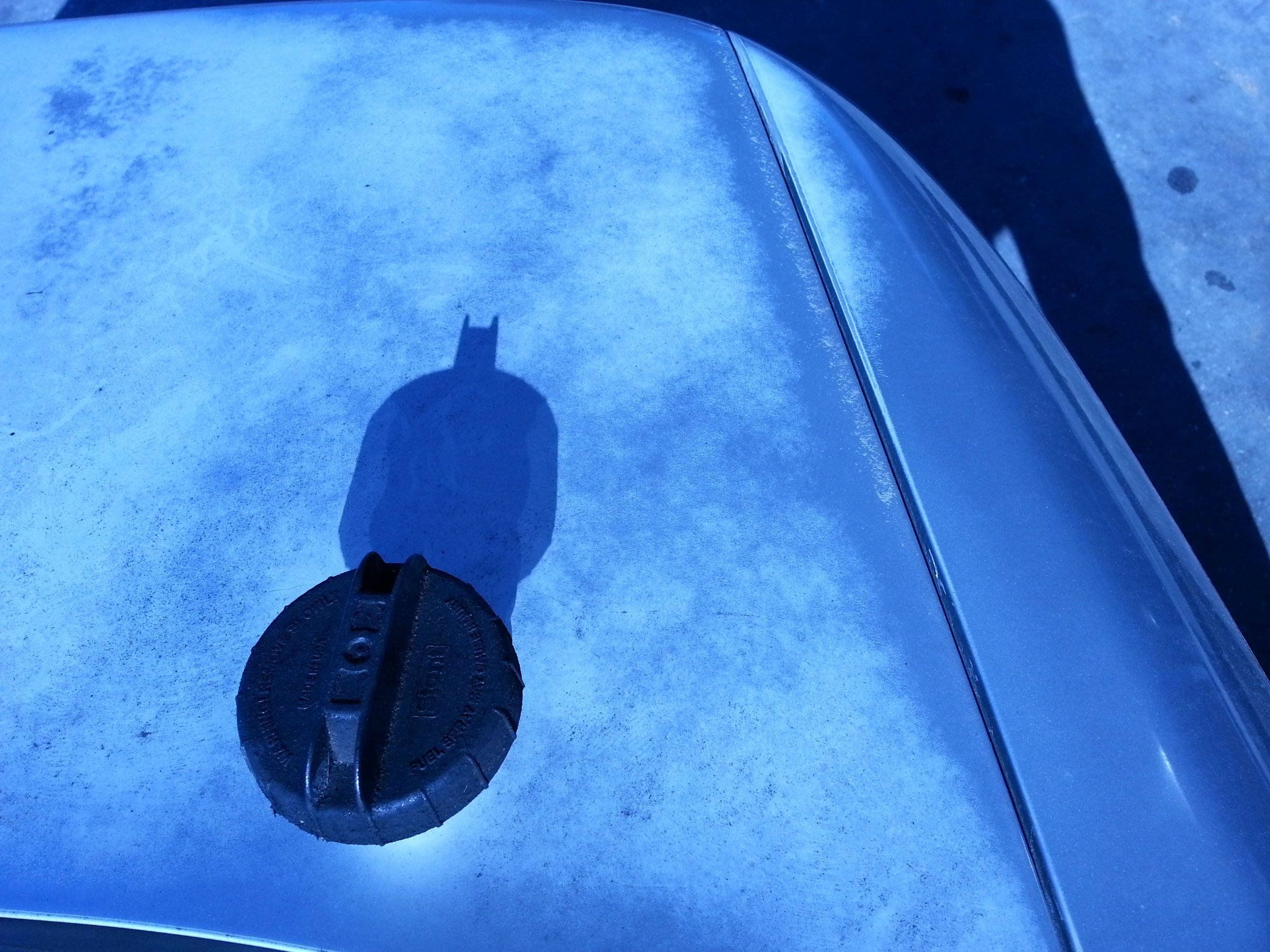 The shadow of this guy's gas cap looks like Batman.