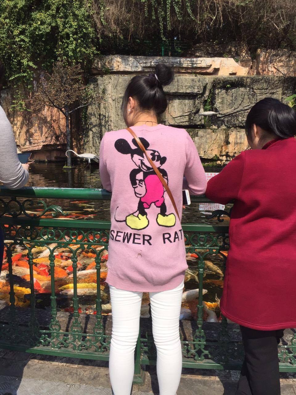 My girlfriend's in China, she sent me photo of girl wearing Mickey Mouse shirt, but something's not quite right...