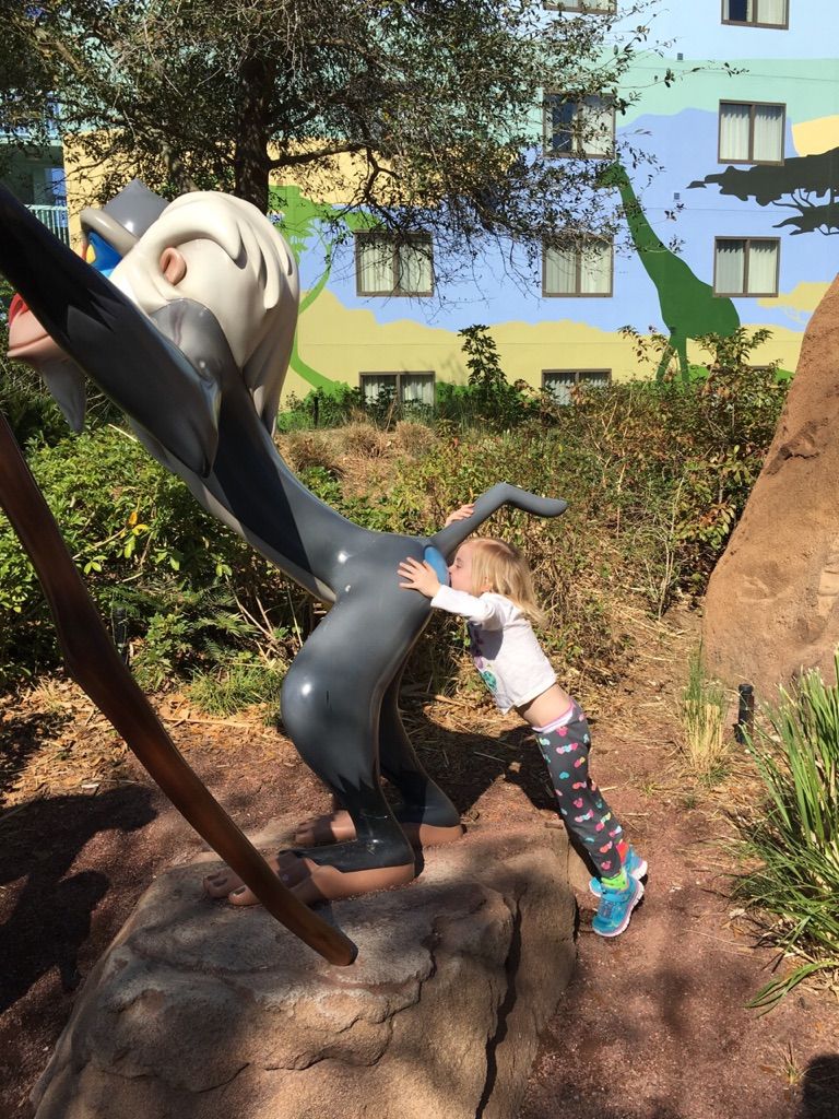 At Disney, daughter said "Mom take a picture of me giving Rafiki a kiss".