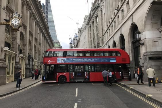 A London bus does an Austin Powers and gets stuck attempting a 3,000 point turn.