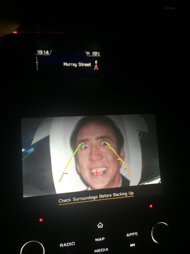Stuck a photo of Nick Cage to the reverse camera of my boyfriends car... he just got Caged!!