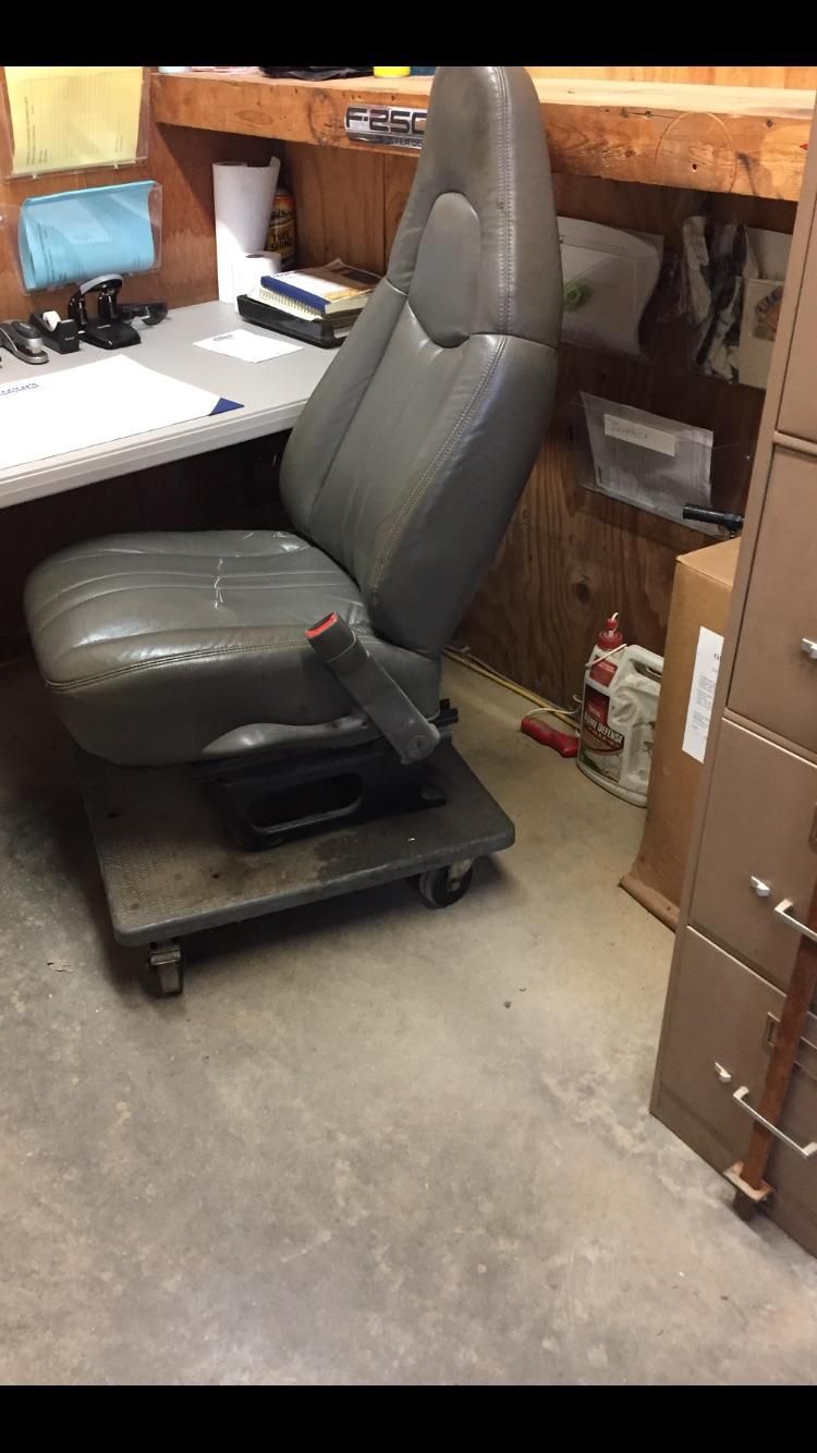 The company I work for wouldn't buy the guy that runs the shop a new rolling chair... so he improvised and rides in style.
