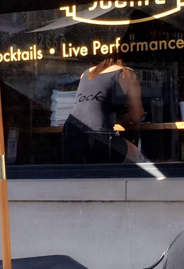 This window advertisement left an awesome shadow on this restaurant patron.
