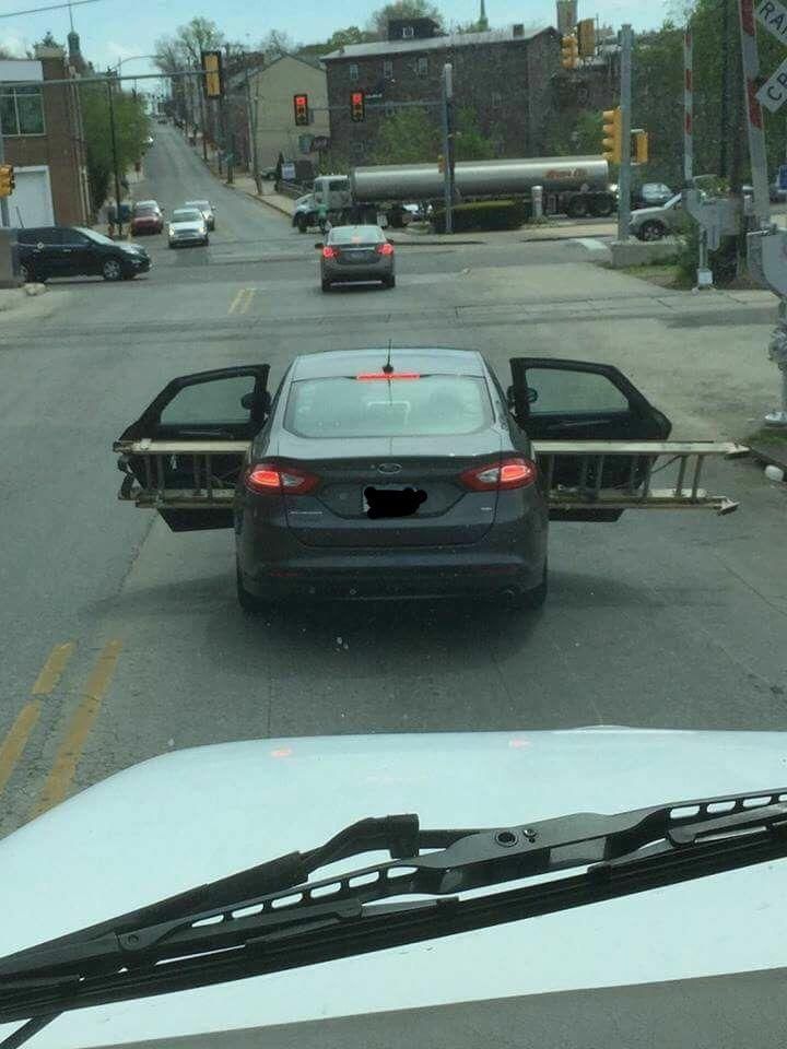 Transporting a ladder in the back seat of a sedan. Love me some Norristown, PA.