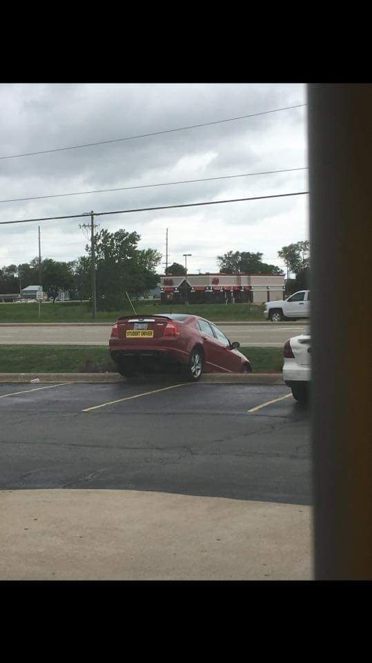 This happened outside my buddy's workplace. The student driver sticker really brings it all together.