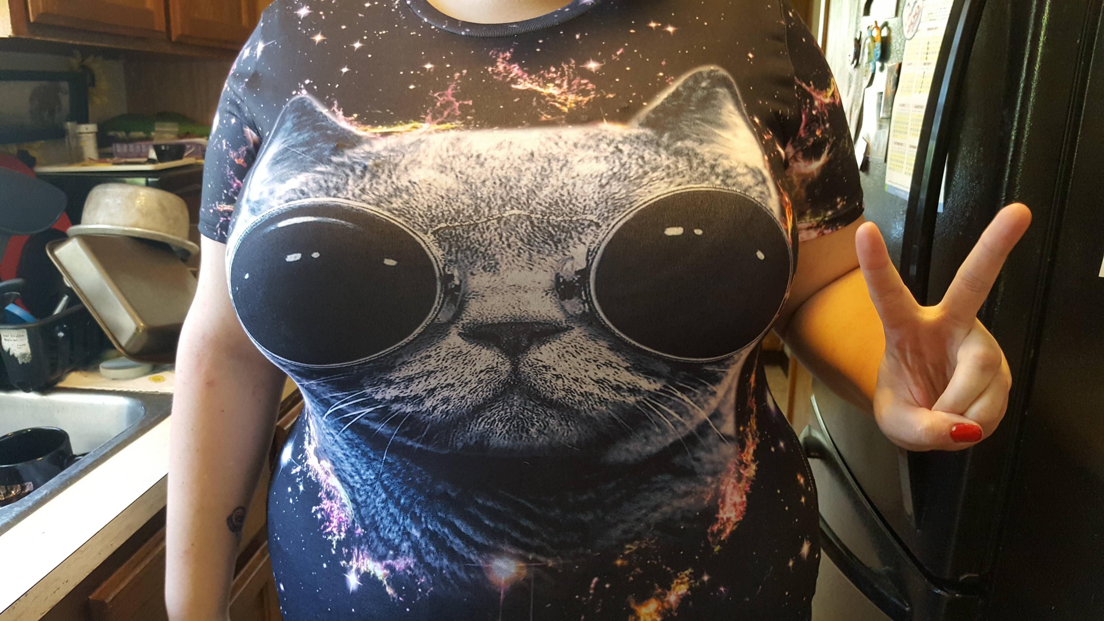Blessedly breasted friend was excited about her new cat shirt until she realized how googly eyed she made the cat look.