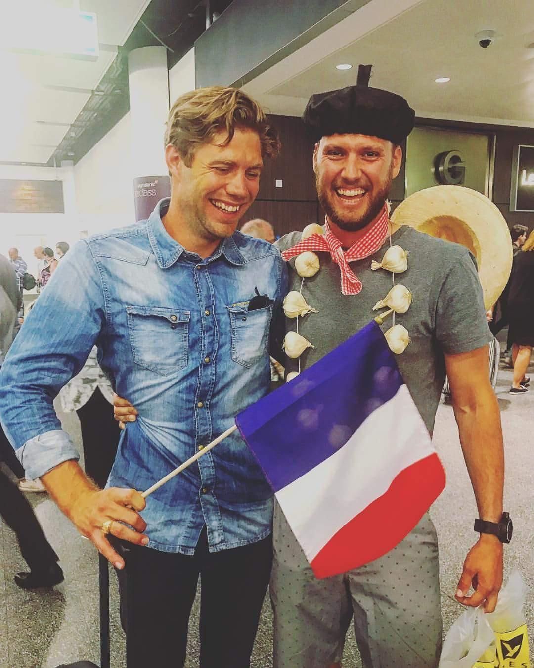English guy picking up his French friend at the airport.