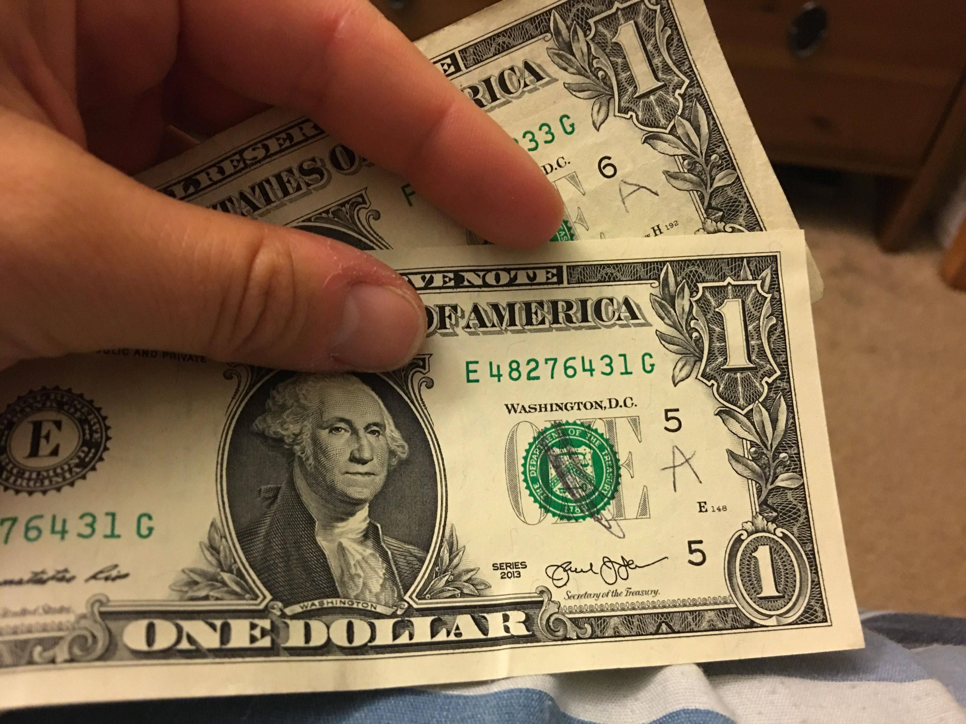 My kid marked all of my one dollar bills to see if the tooth fairy is fake