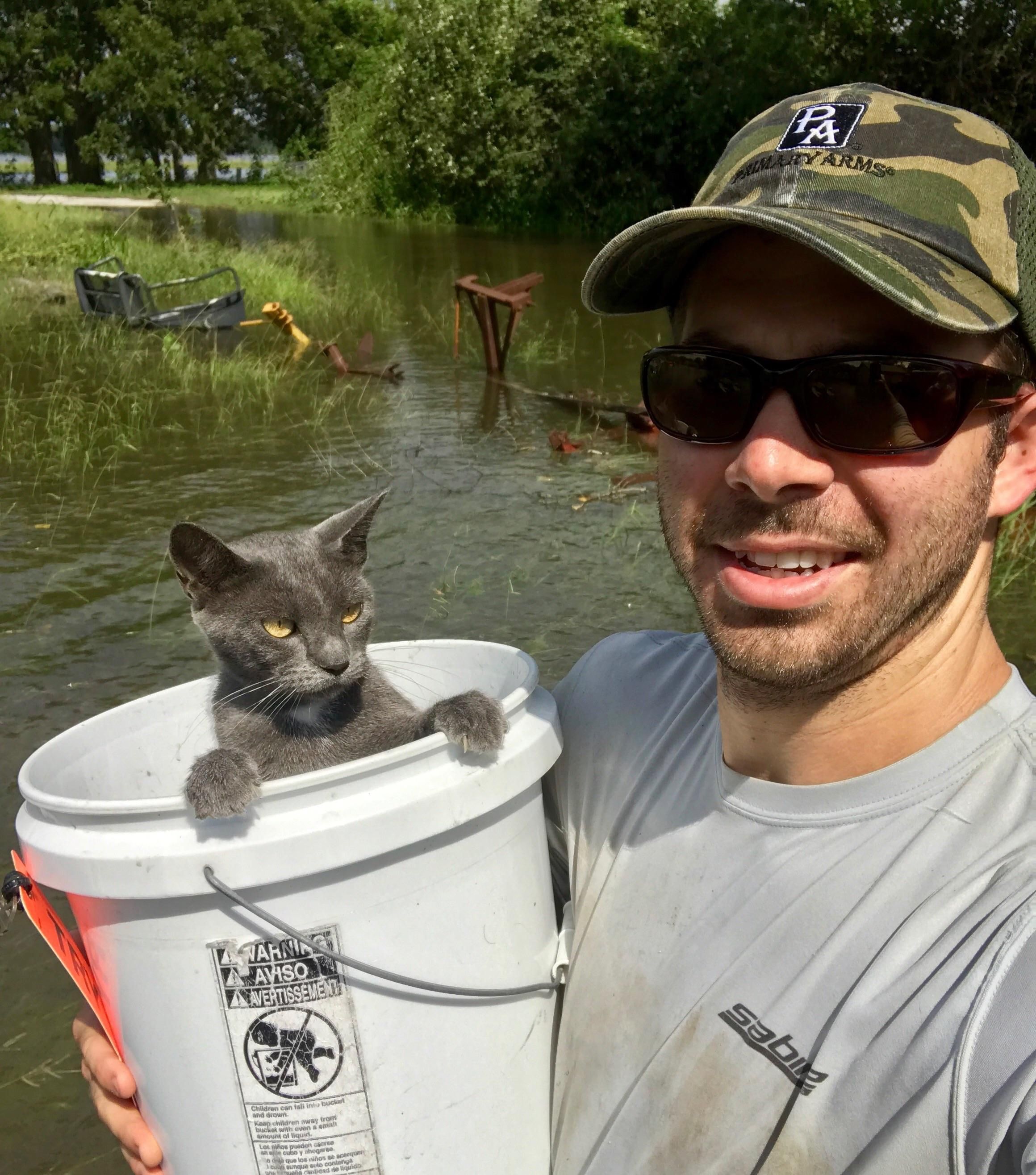 Even when being rescued from hurricane floods, this cat is just over it.