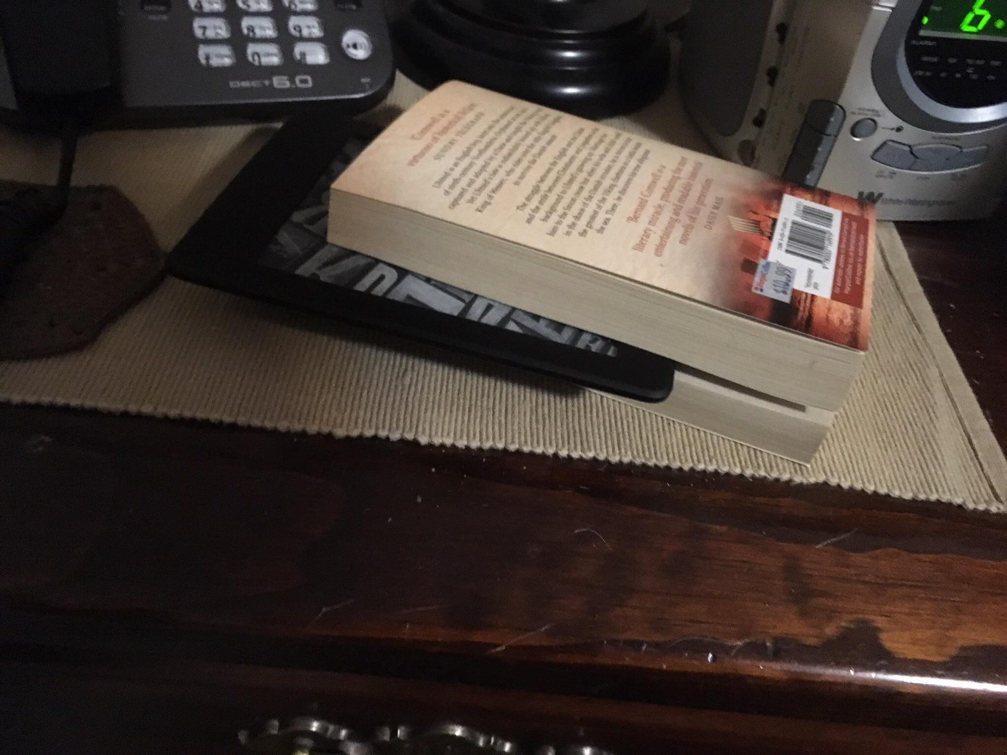 My dad likes reading so I got him a Kindle for is birthday. He's using it as a bookmark.