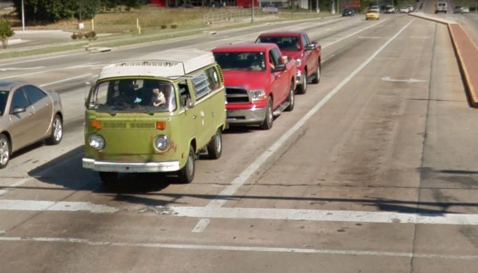 Pug driving a VW bus in google streetview