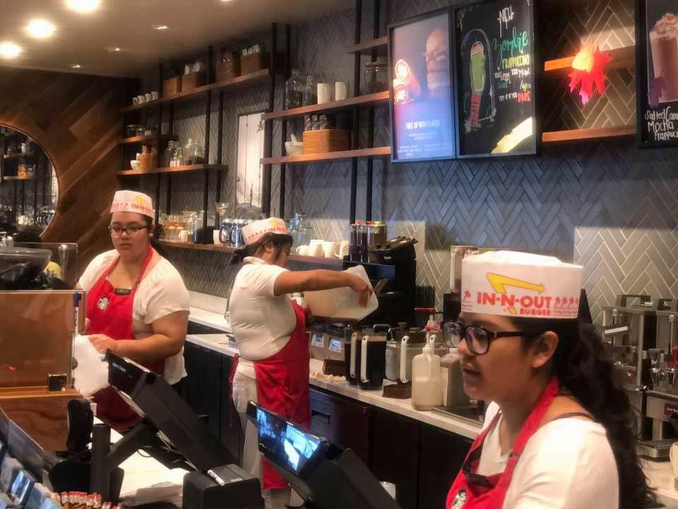 Starbucks baristas dressed as In n Out employees for Halloween