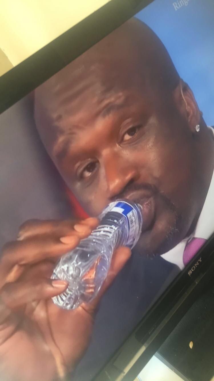 Shaq makes the water bottle look like it's kid size.