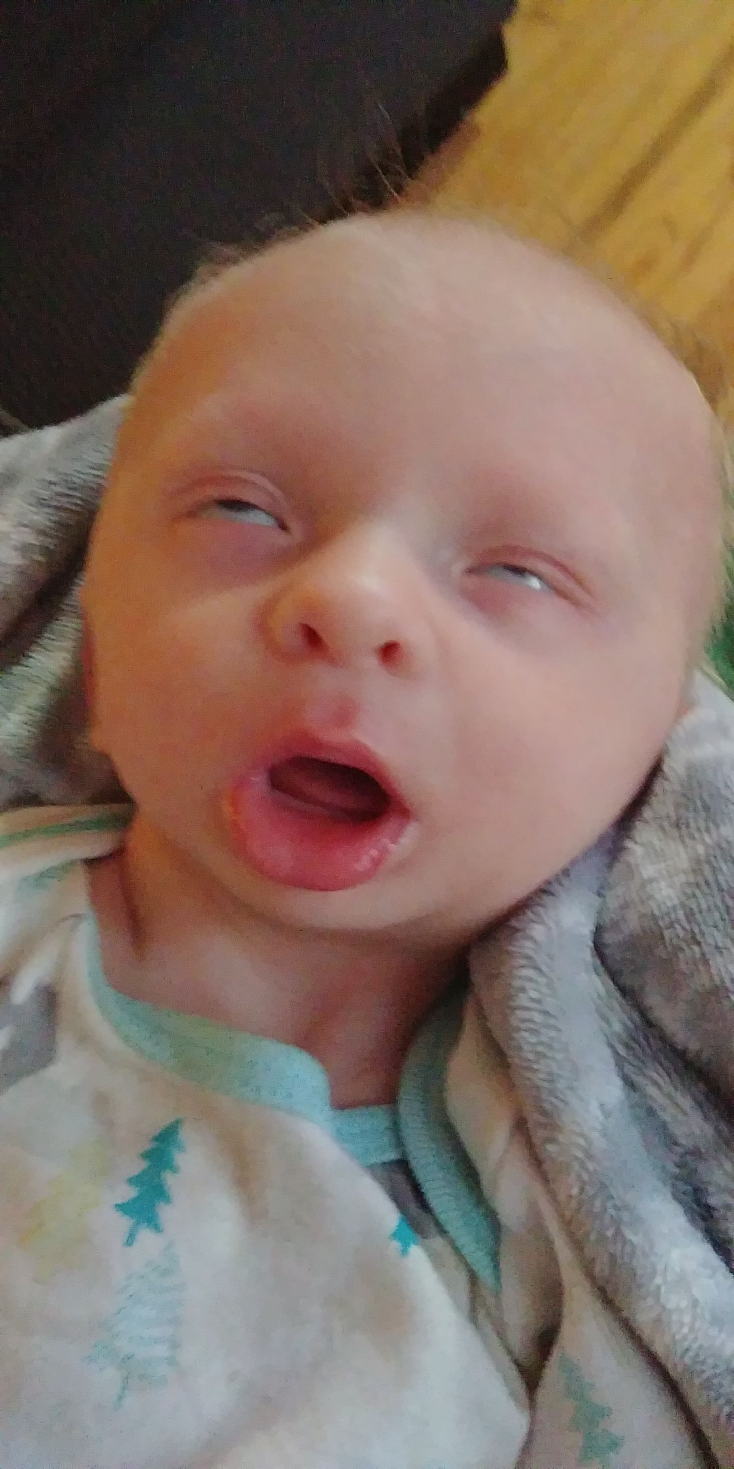 My son is basically a potato with hands and doesn't smile yet, but he does do this...