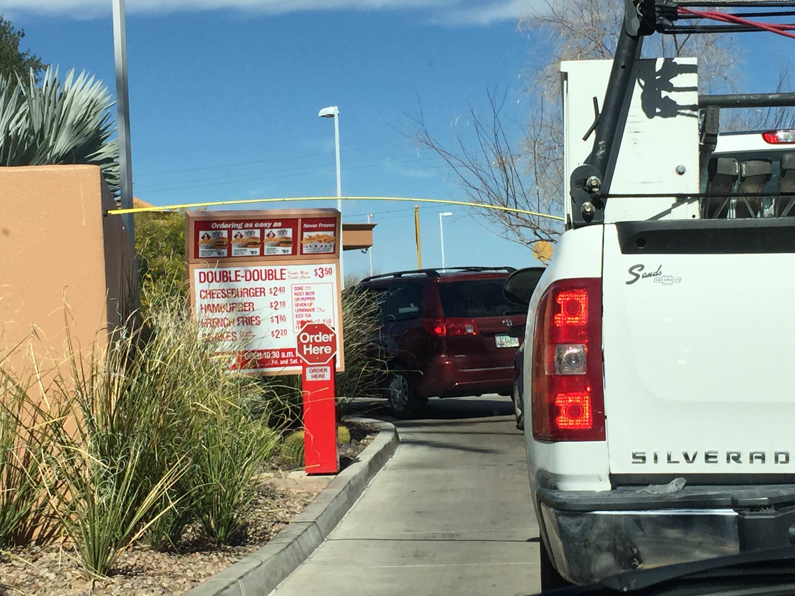Bored in line at In-N-Out, these construction workers tried to see what they could reach with their measuring tape.