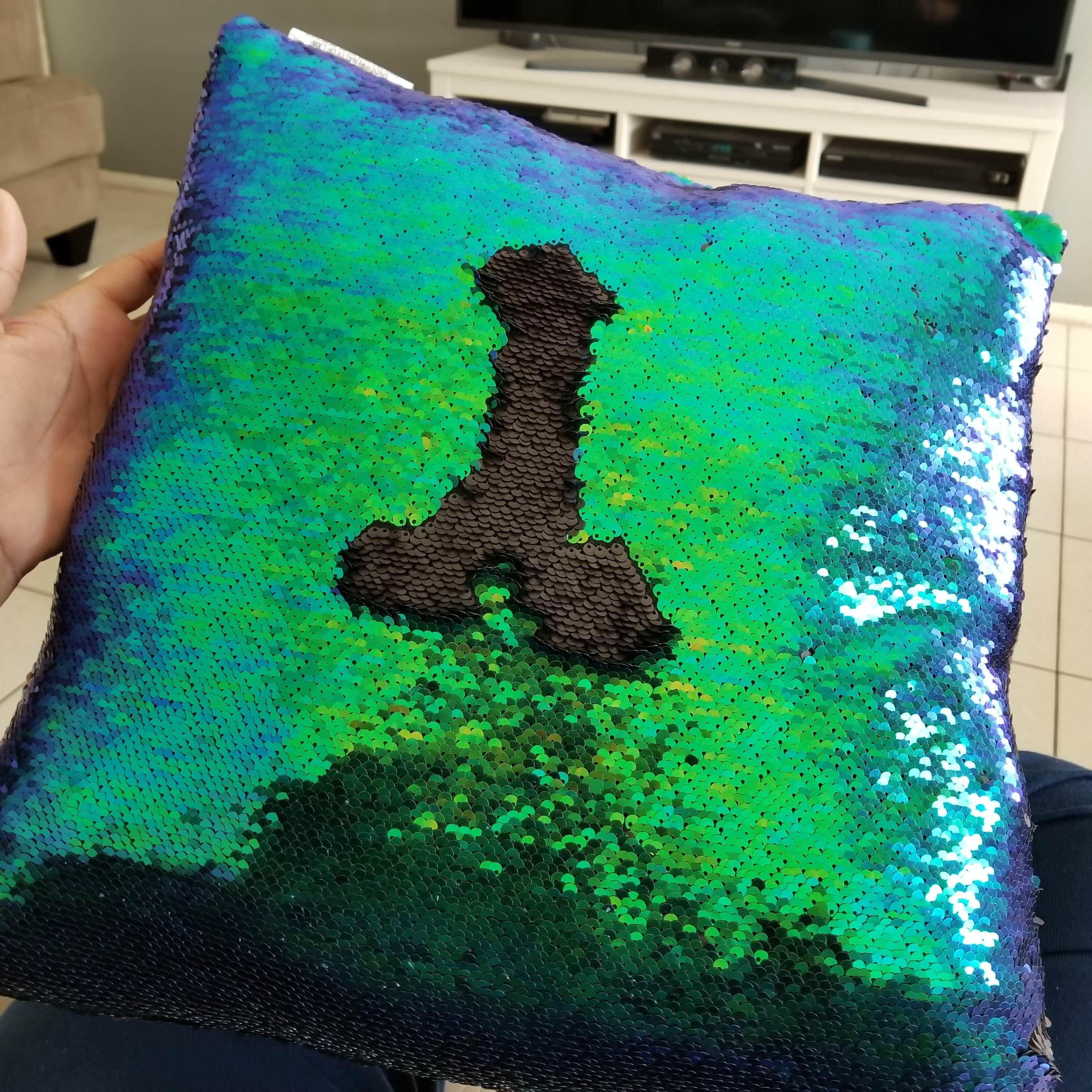 Our daughter used a reversible sequin pillow to draw the "Eiffel Tower". Lol!