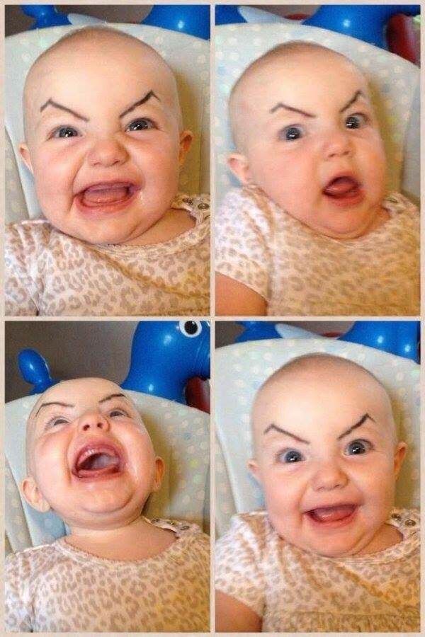 Drawing angry eyebrows on a baby