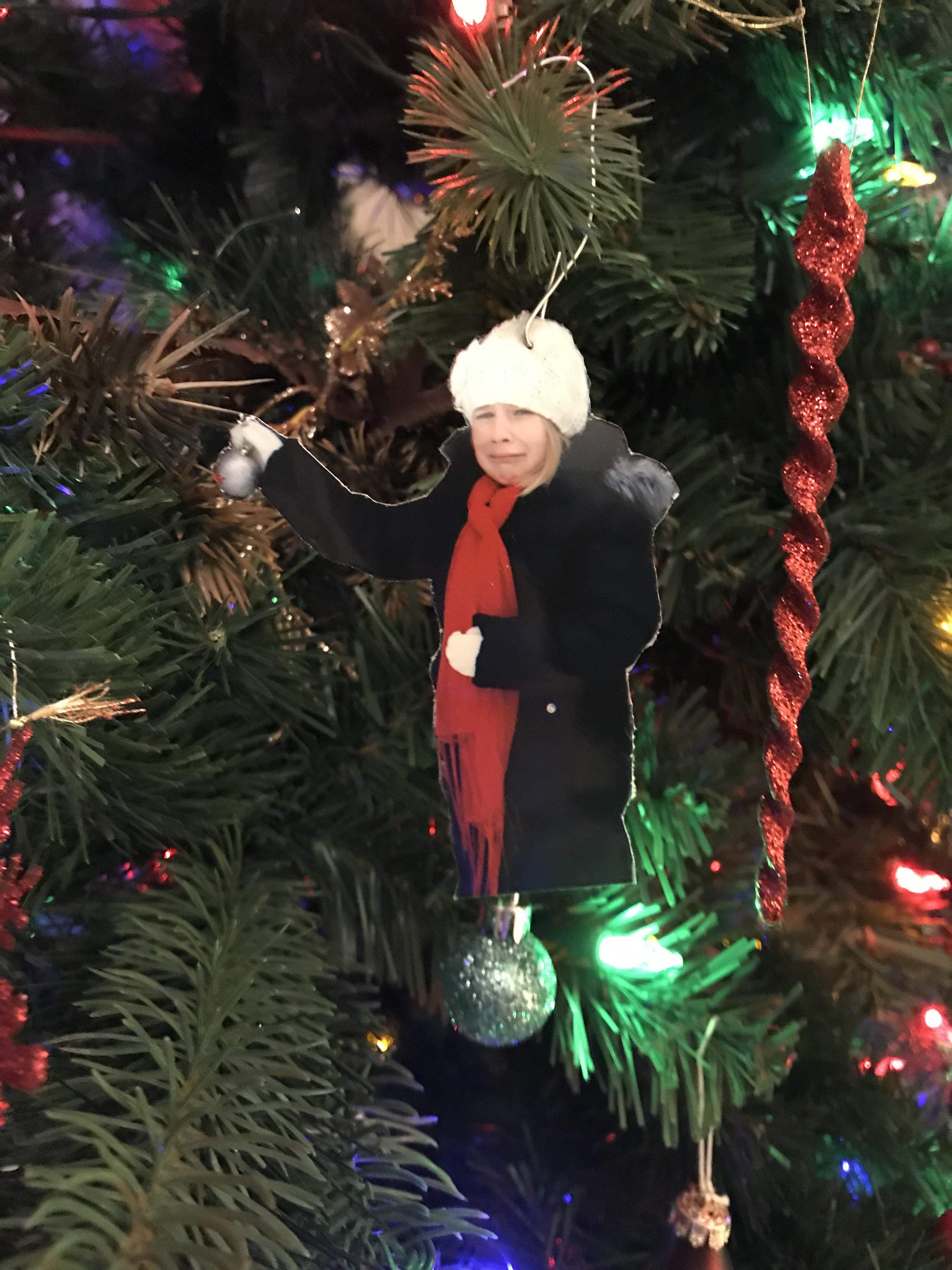 My step-daughter had a melt down while taking Christmas pictures a few years ago so I made this ornament that we now hang on the tree every year.