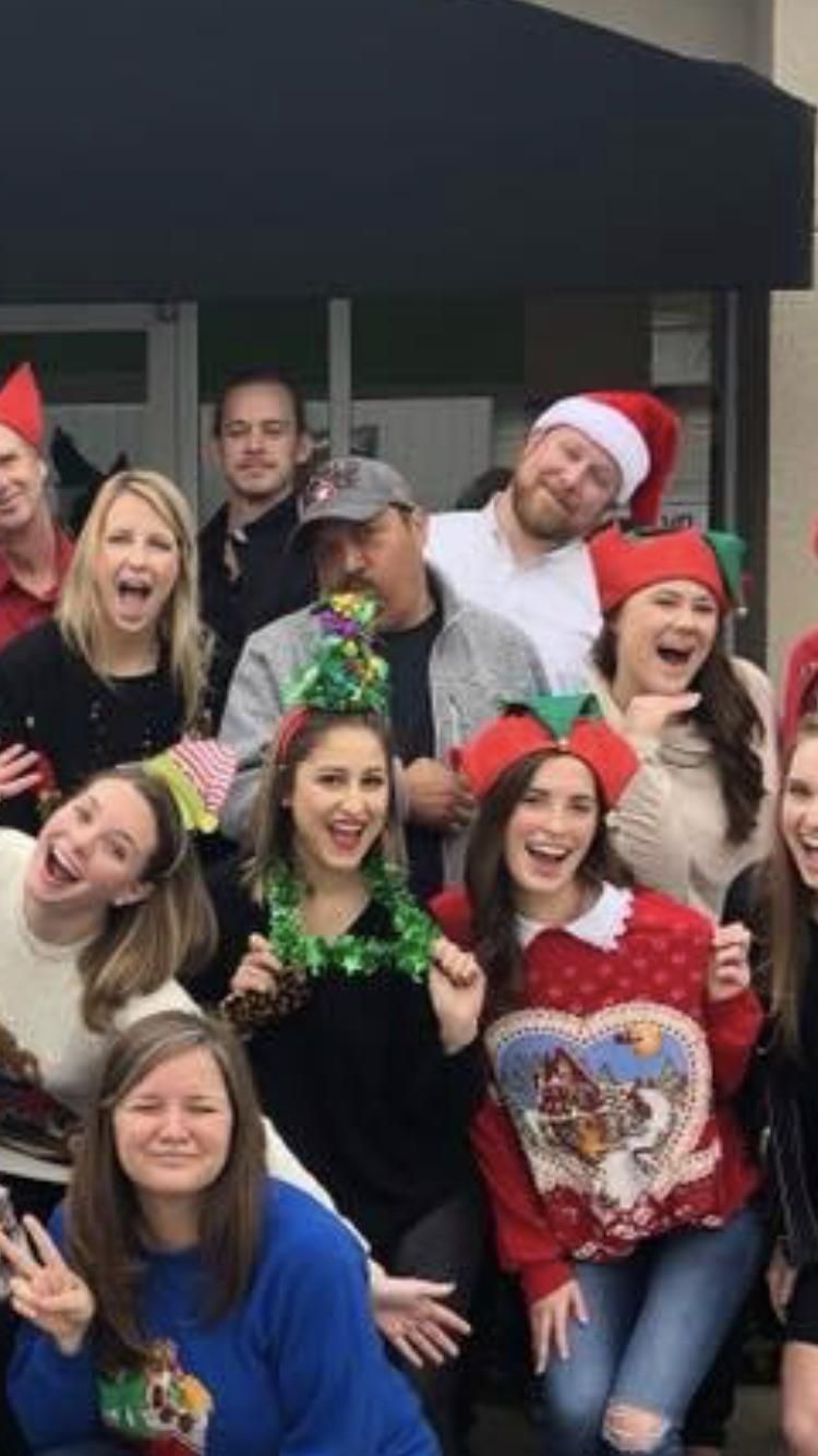My coworker looks like he is spewing Christmas joy all over the girl in front of him.